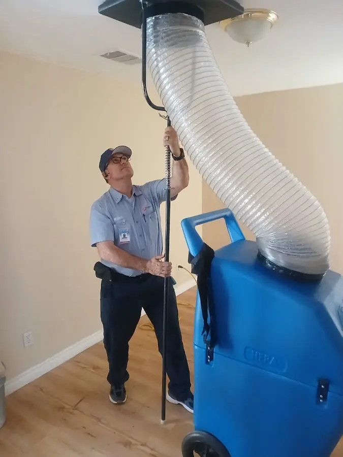 Furnace Tune-Up technician using HEPA equipment in Villa Park